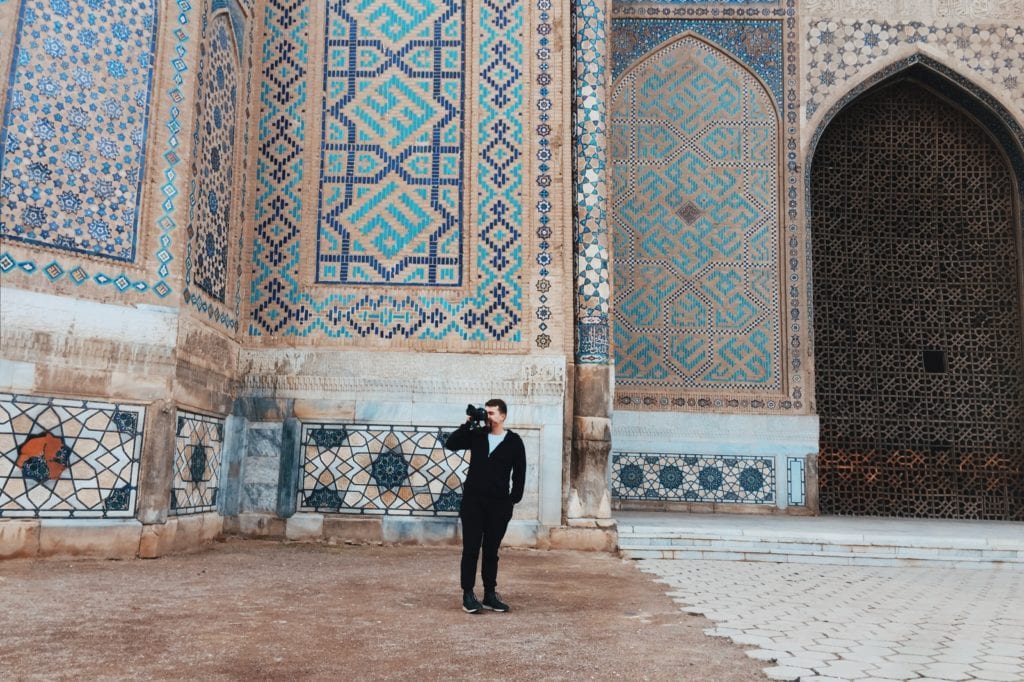 Travel photographer front of an architectural marvel in Samarkand, Uzbekistan