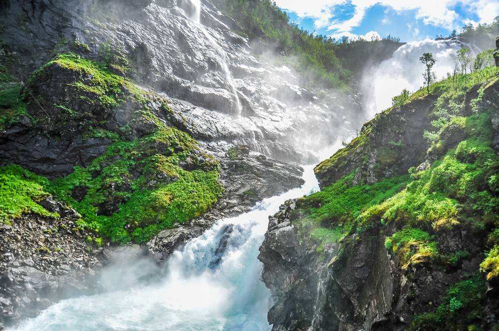 Beautiful view of Kjosfossen waterfall through the hill in Aurland, Norway