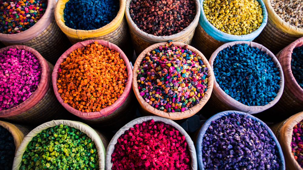 colorfull spices in round baskets in the souk of marrakech