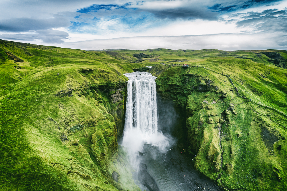 Iceland waterfall Skogafoss in Icelandic nature landscape.