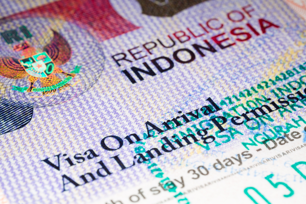 Visa to Indonesia (Visa on arrival to Republic of Indonesia). Visa stamp in passport. Illustrative image. Macro photo, selective focus