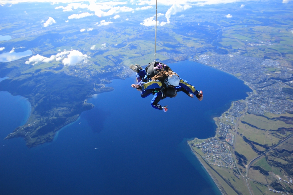 Tandem free fall sky diving with 15,000 feet at Lake Taupo, New Zealand.