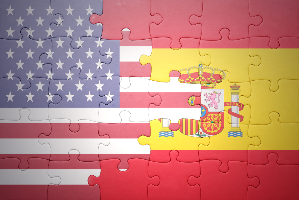 puzzle with the national flag of united states of america and spain 