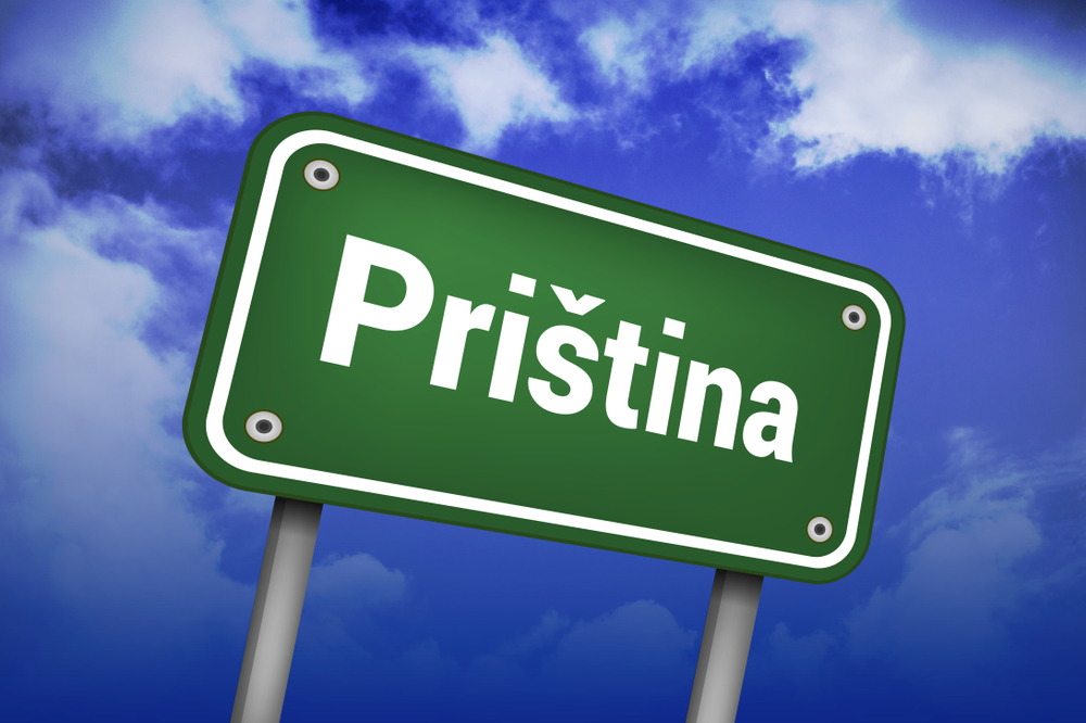 A road sign with Priština words on sky background