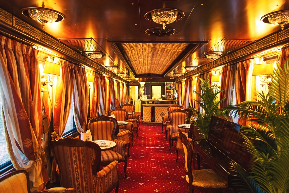 Interior of luxury vintage old train carriage. Retro train from the early 20th century.