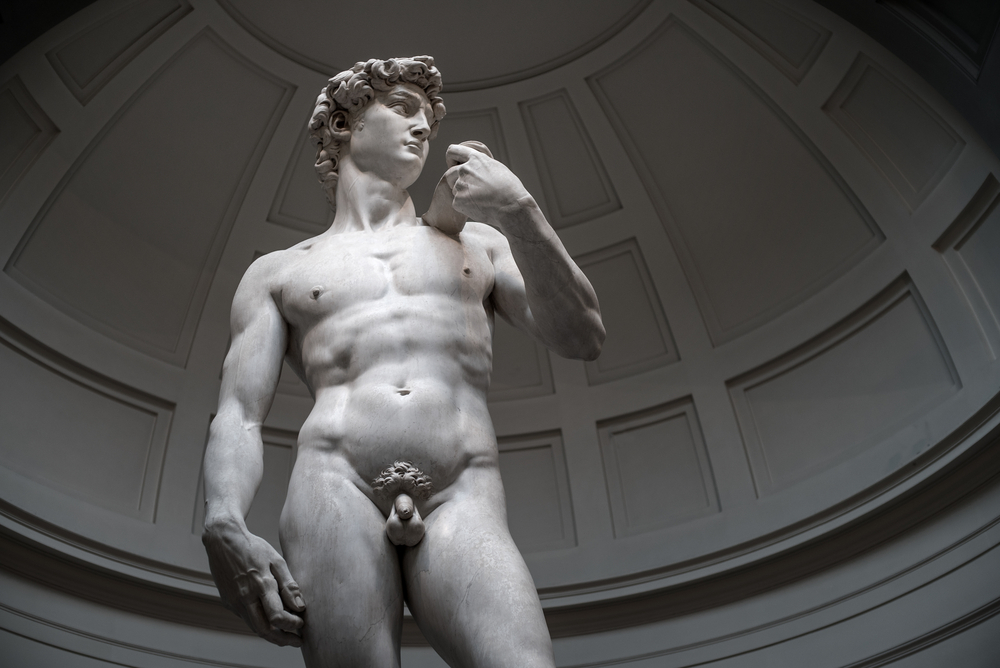 Tourists look at David by Michelangelo on January 5 ,2016 in Galleria dell'Accademia in Florence. Italy.