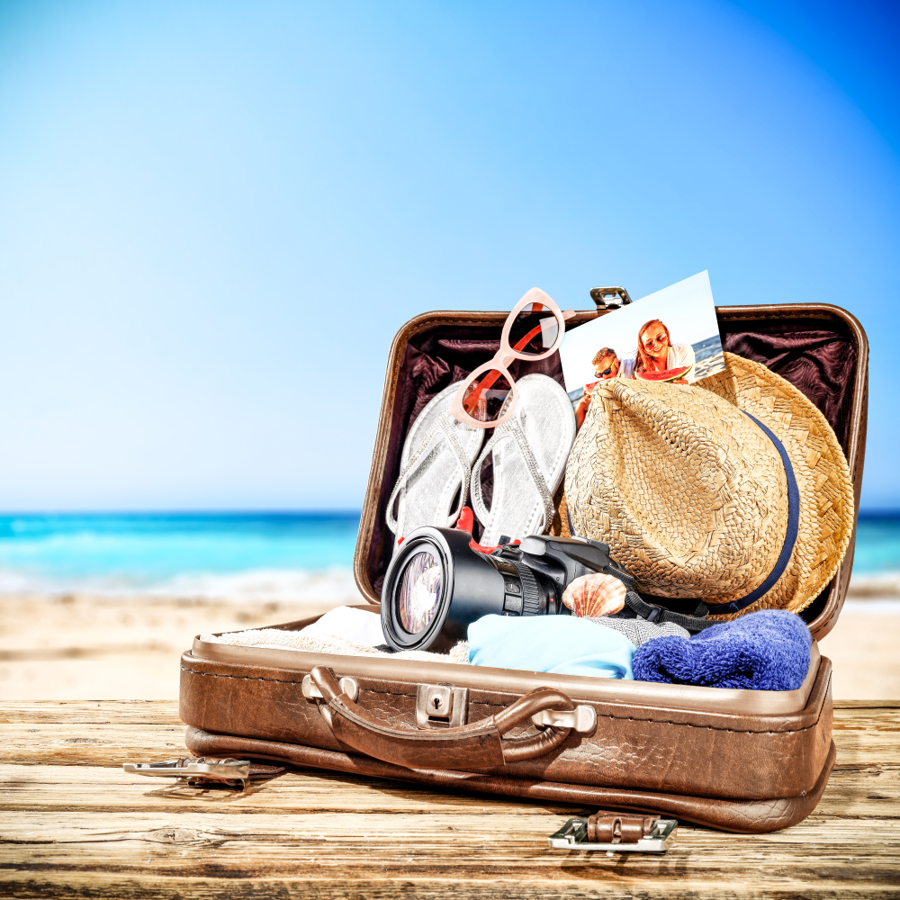 Suitcase of brown color and summer time. Free space for your decoration.