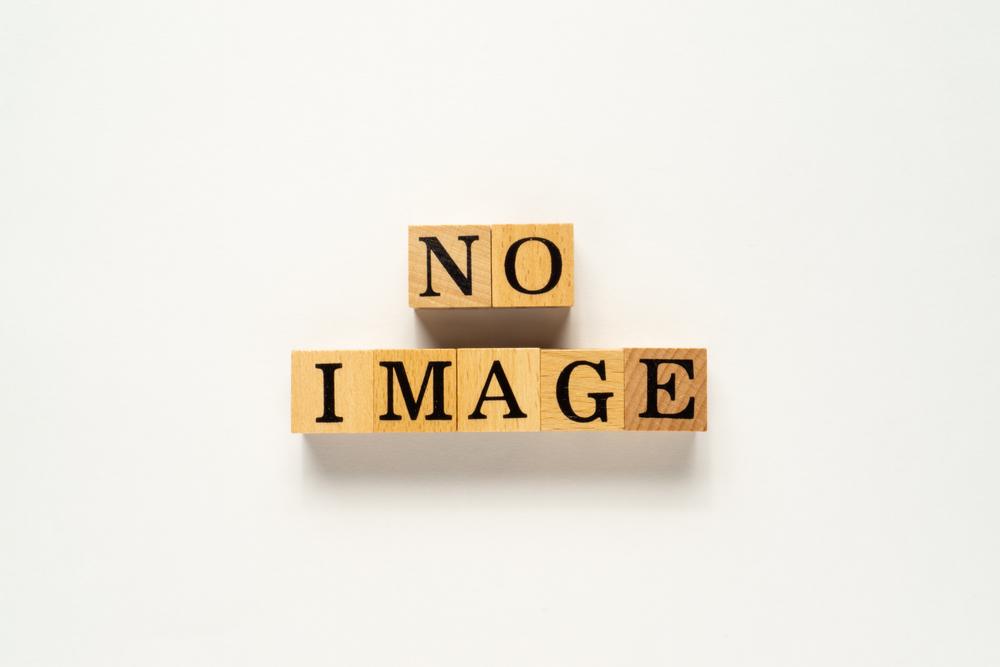 Creative concept 'No Image' word on wooden cube. Flat lay view concept on a white background.