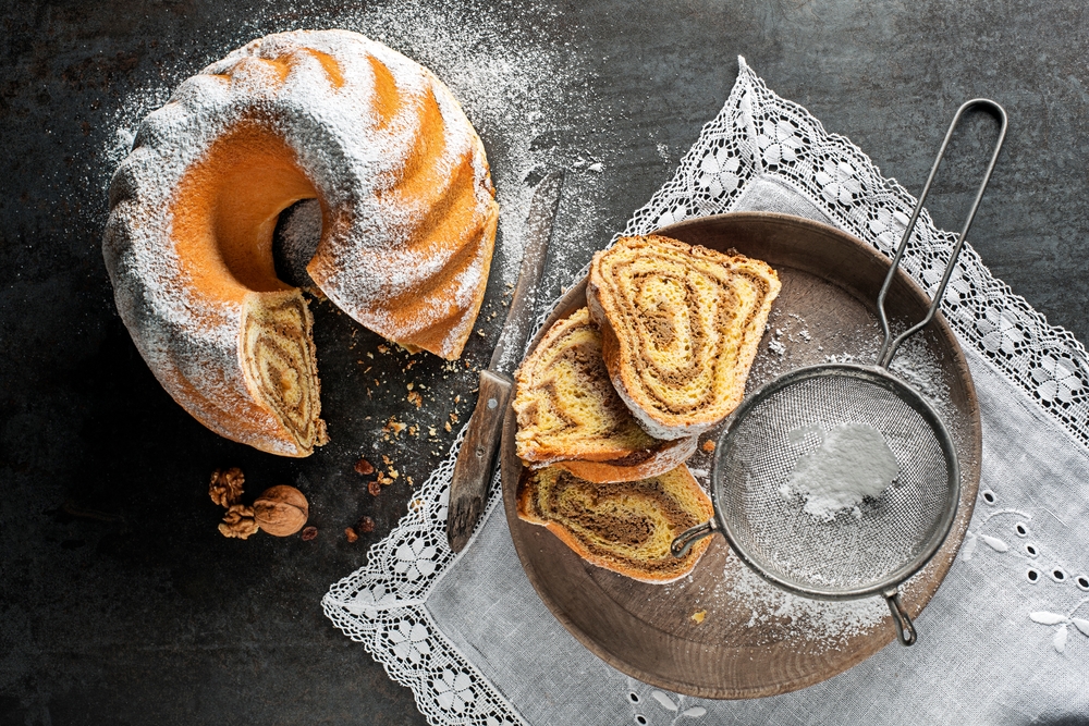 Potica, traditional Slovenian bread cake roll with walnuts. Sweet bread roll stuffed with walnuts and sprinkle with sugar