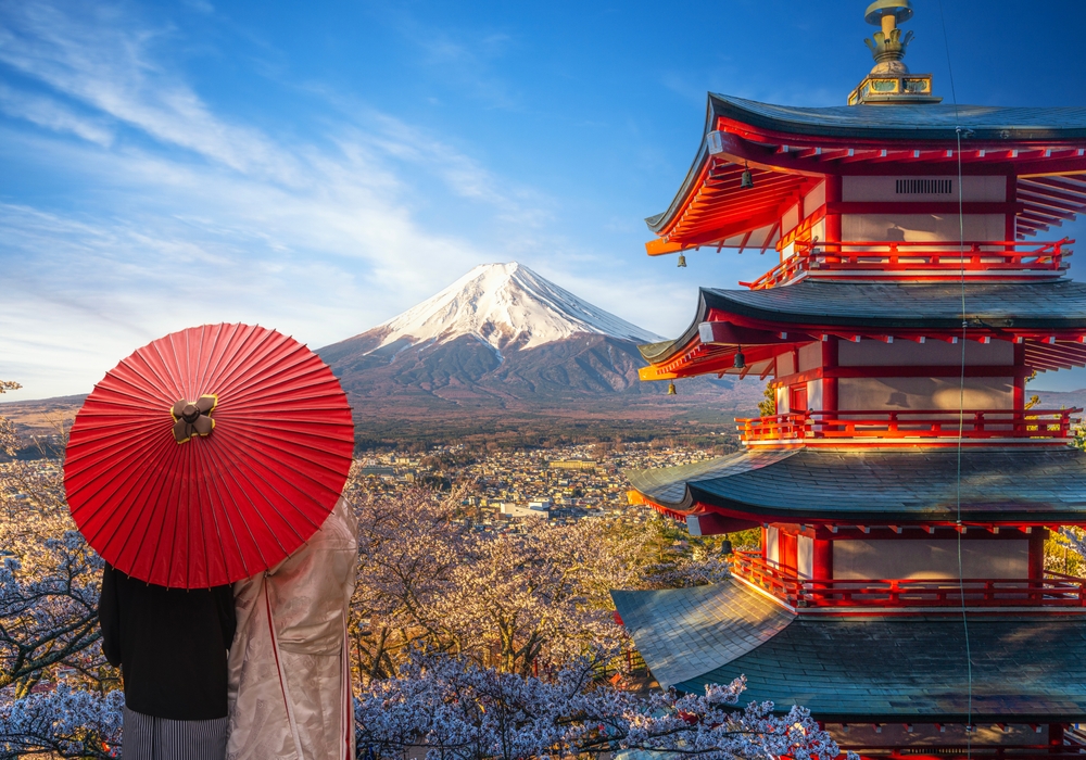 Red chureito pagoda with cherry blossom and Fujiyama mountain on the day and morning sunrise time in Tokyo city, Japan