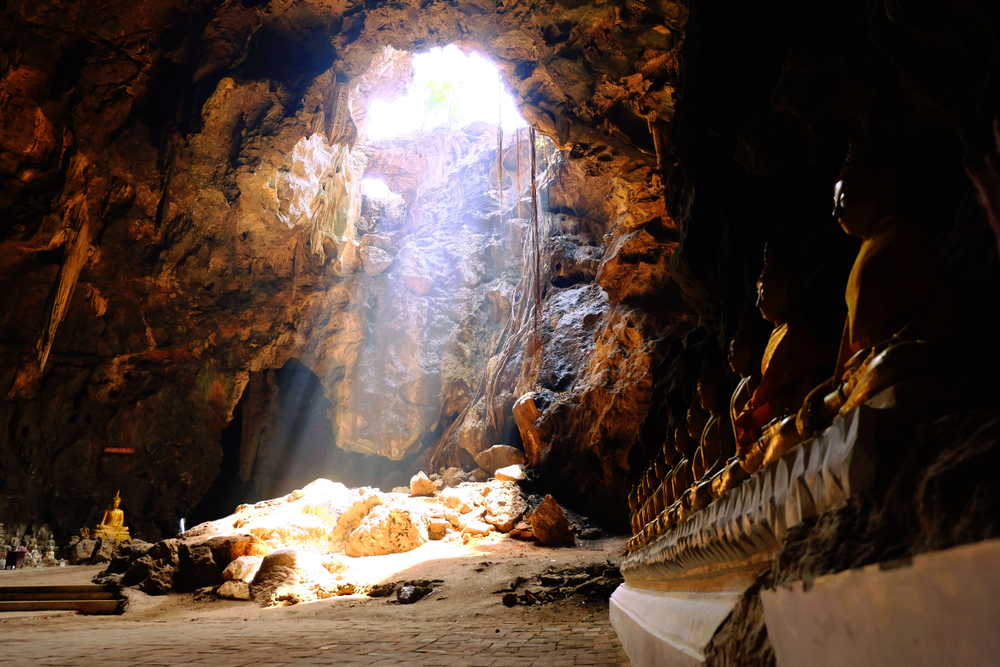 Sunlight shines in the cave. See the sculpture In Nam Ngum Luang, Thailand