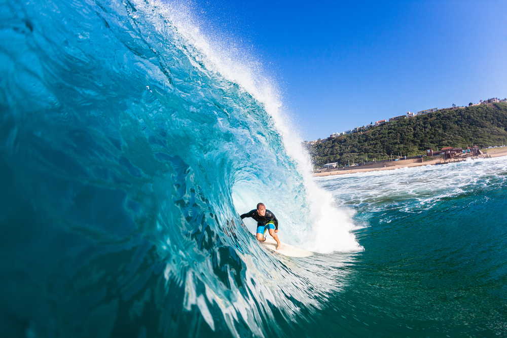 Surfing Inside Hollow Blue Wave Surfing surfer tube rides inside large hollow blue water ocean wave