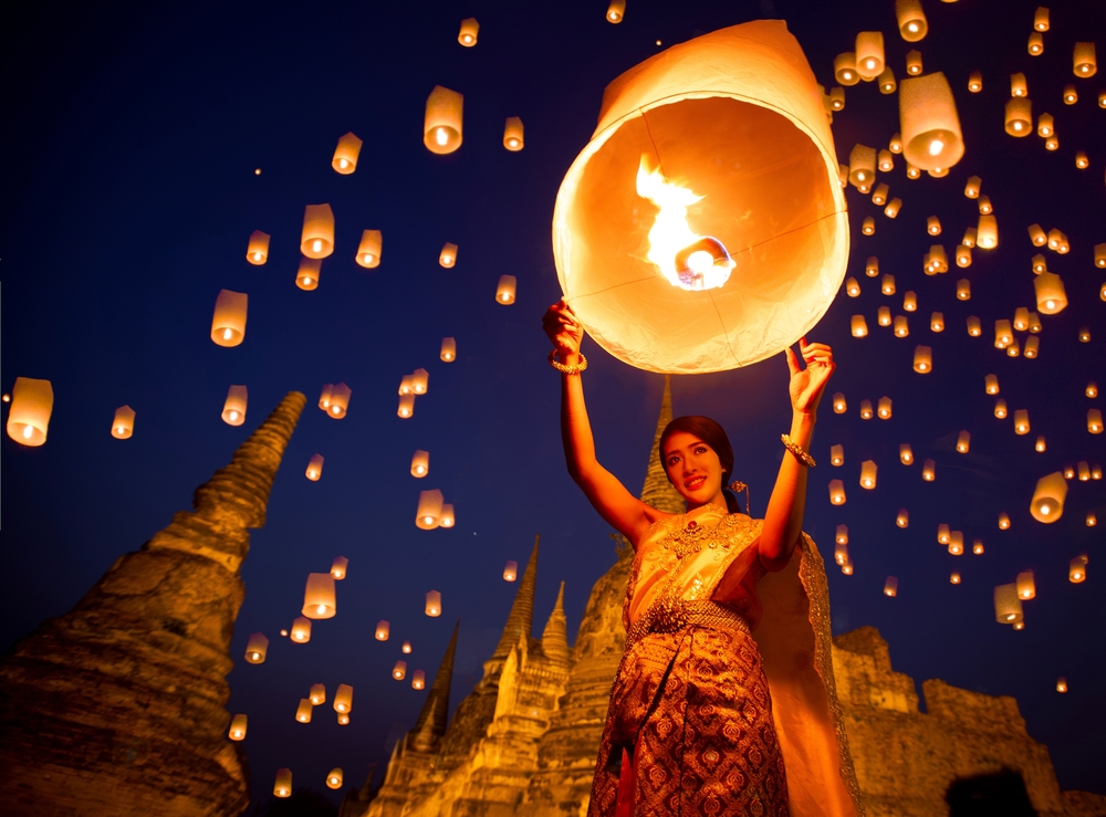 Thai lady in Thai dress enjoy yee peng festival in Ayutthaya city near Bangkok, Thailand, Asia travel concept
