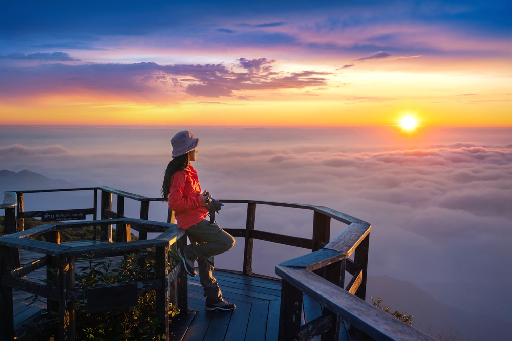 Tourist enjoying sunset at Kew Mae Pan viewpoint in Doi inthanon, Chiang Mai, Thailand.