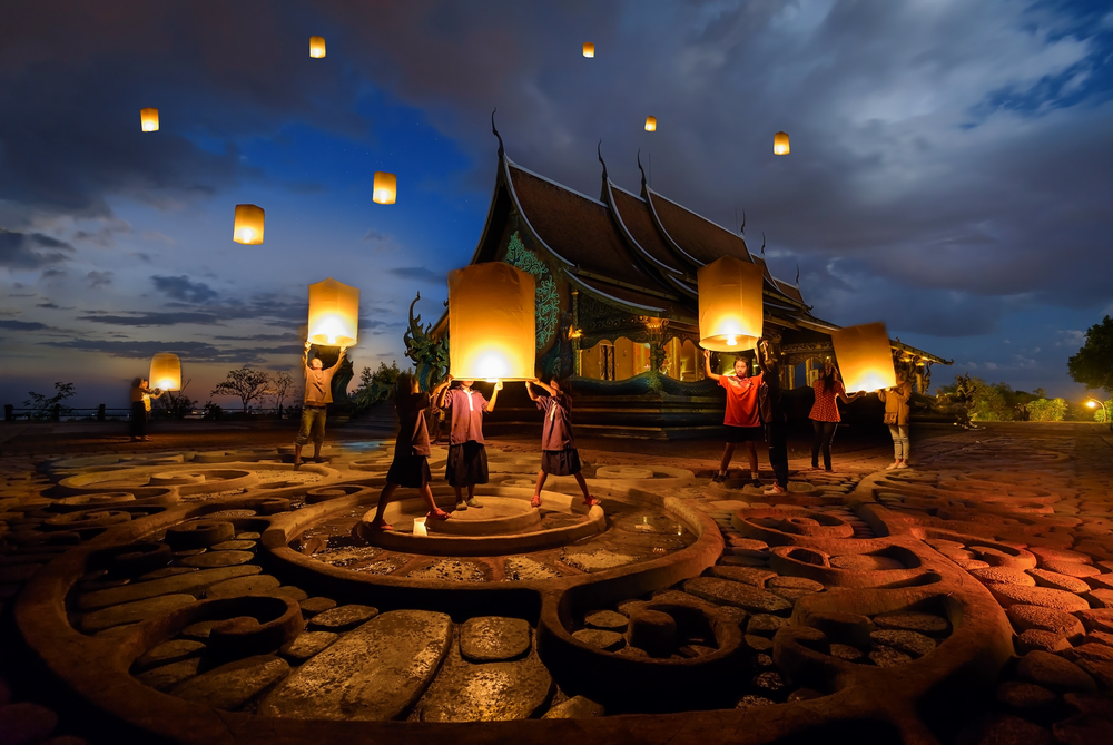 People floating lamp in yeepeng festival at pagoda tree glow temple