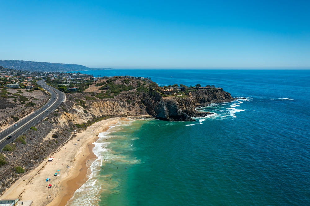 South-Facing Aerial Photo of a Beach and Protruding Cliffs Near Pacific Coast Highway in Newport Beach, California