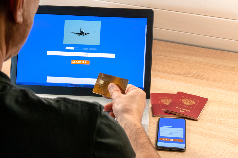 Online search and booking of flight tickets using a laptop and smartphone