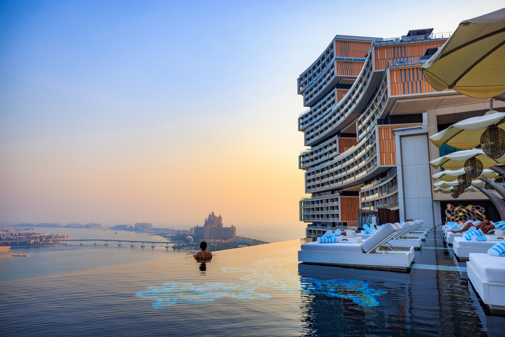 Sunset view of the infinity pool overlooking Palm Jumeirah at the Atlantis Royal