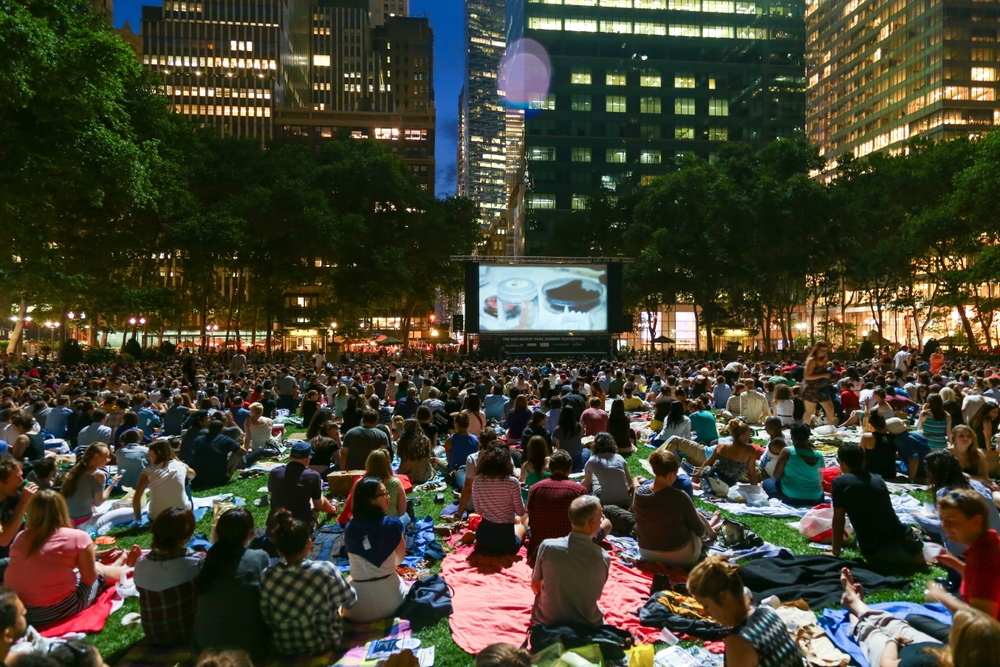 Newyorkers and tourists enjoying the Bryant Park Summer Film Festival