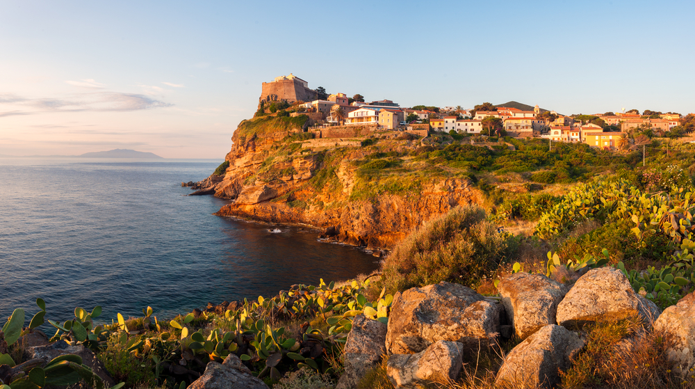 Panorama of Capraia city on the rock of Isola di Capraia island at sunrise, Tuscany, Italy, Europe