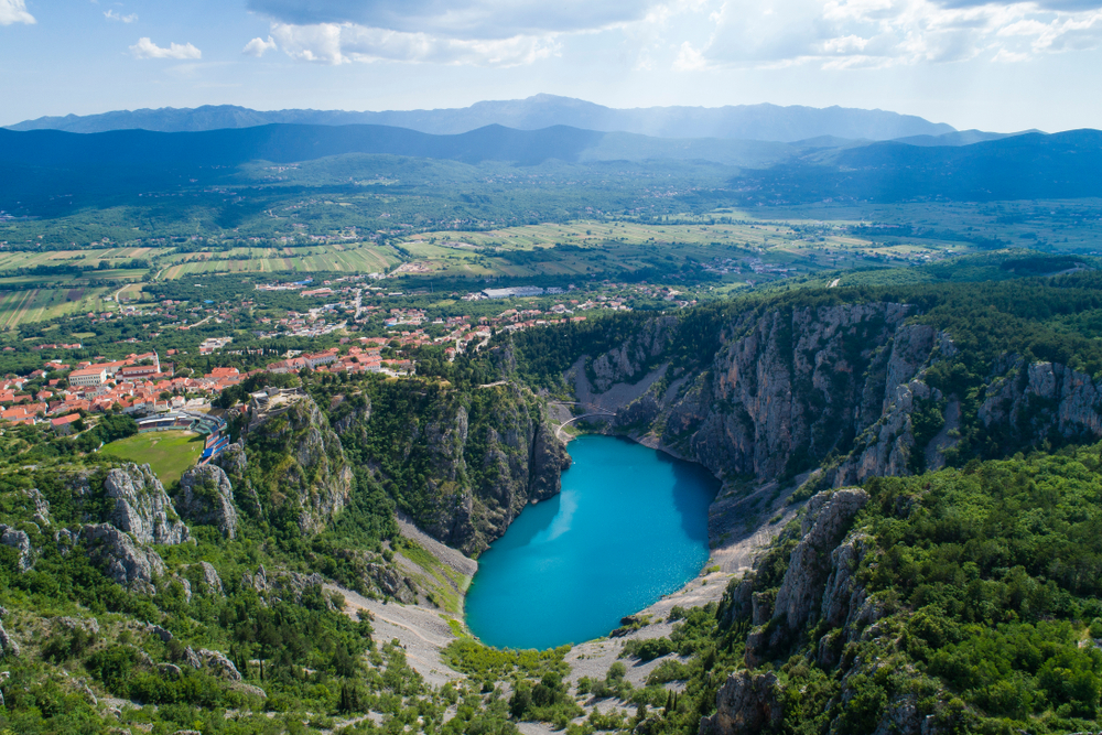 Beautiful nature and landscape photo of Blue Lake in Imotski Dalmatia Croatia on warm summer day.