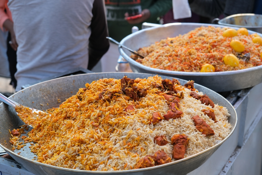 Men selling Chicken biryani in Delhi street, front of Jama Masjid in old Delhi