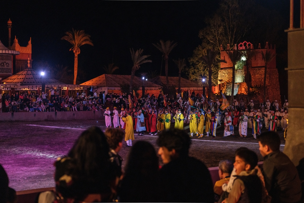 Fantasy Show in Chez Ali, a captivating performance blending Moroccan folklore, acrobatics, and traditional music, attracting tourists from around the world.