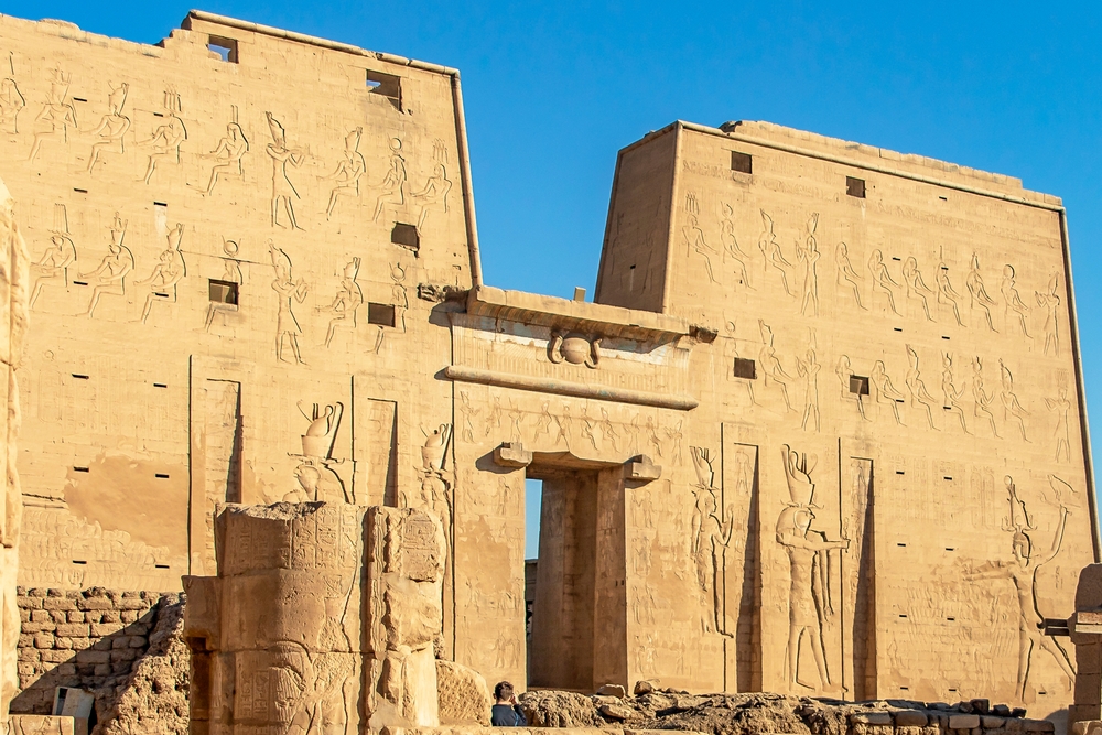 Experience the divine intersection of desert and divinity at the sacred ruins of Edfu.