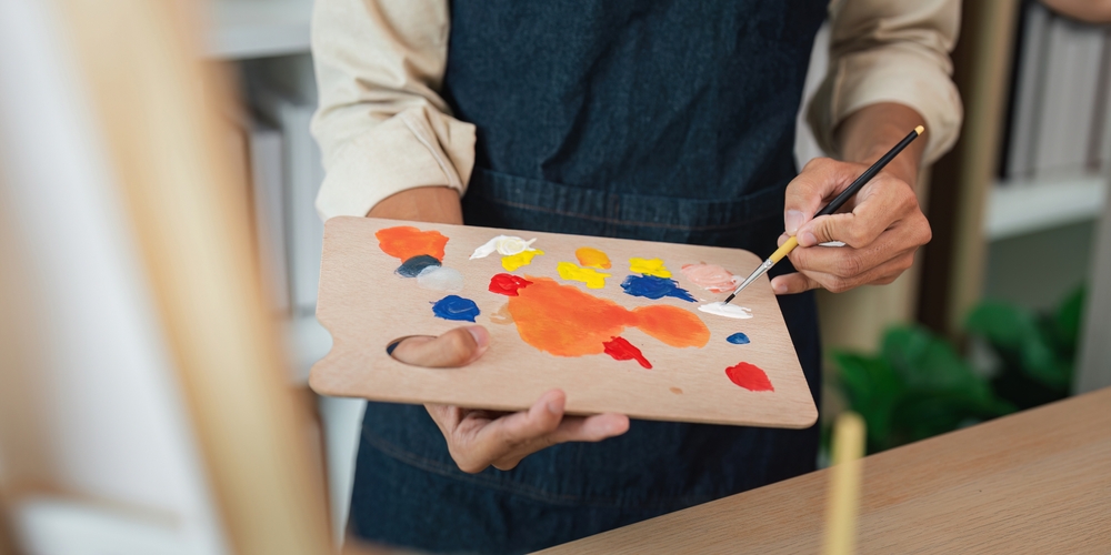 Artist Mixing Paints on Palette in Studio, Close-Up of Hands and Brush, Creative Process, Art Supplies