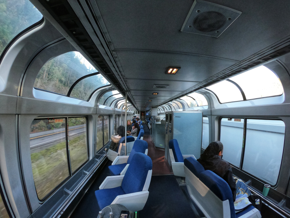 Amtrak observation car enroute from the Coast Starlight line where passengers gaze at the passing scenery.