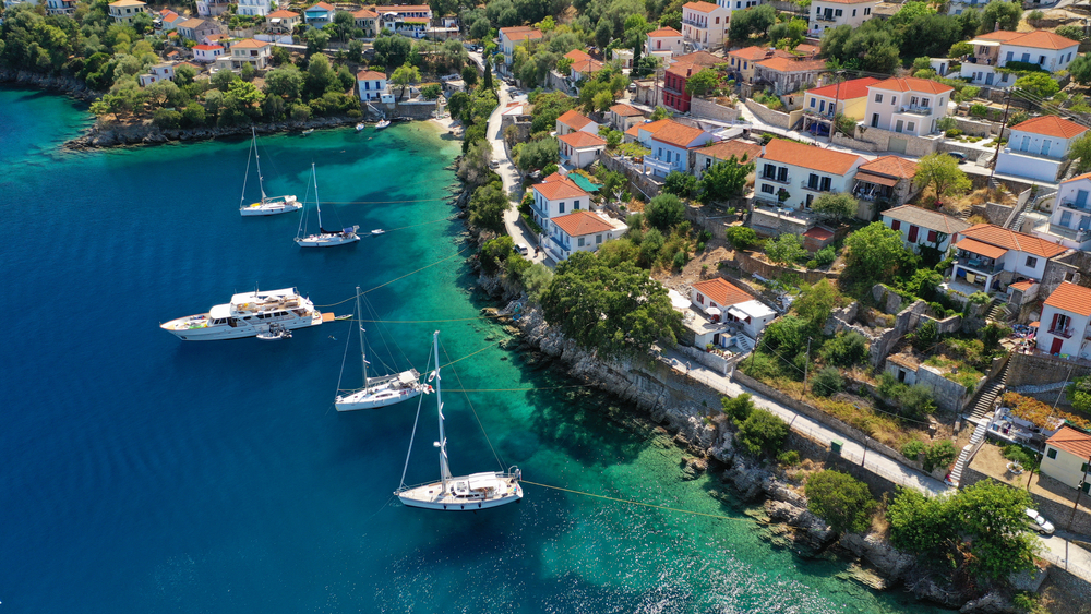 Aerial drone photo of picturesque beautiful seaside village of Kioni a safe anchorage for yachts and sail boats, a true gem of Ithaki or Ithaca island, Ionian, Greece