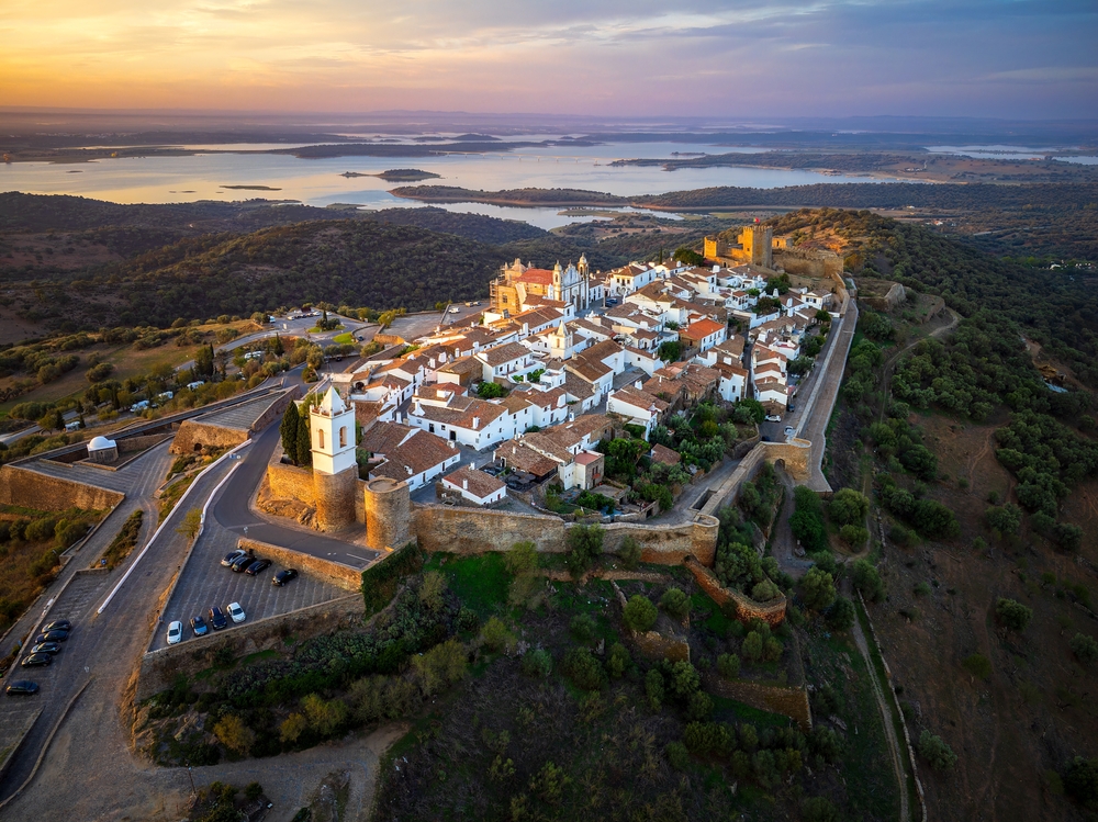 Aerial view of Monsaraz a tiny charming village inside castle walls in Alentejo region of Portugal, at sunrise