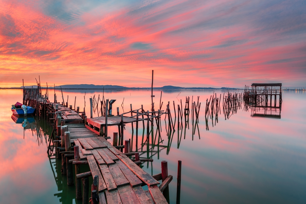Amazing sunset on the palatial pier of Carrasqueira, Alentejo, Portugal.