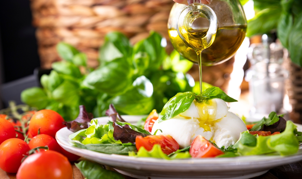 Salad with Tomatoes, Burrata, basil,olive oil. middle name Burratina.