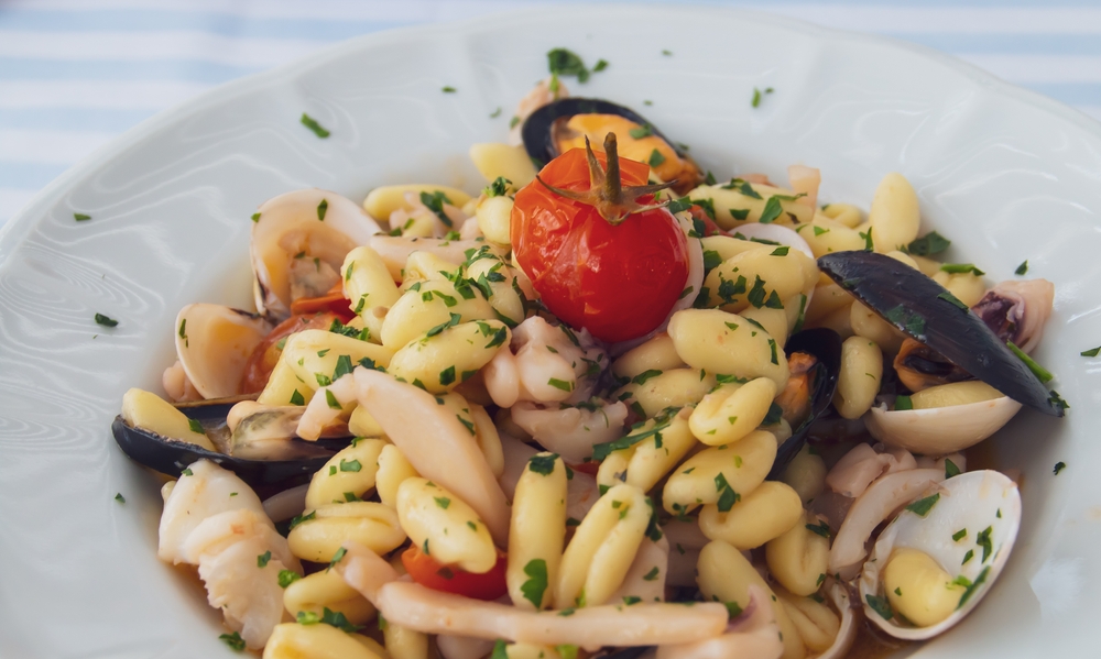 Cavatelli pasta dish with seafood in Polignano a Mare, Italy.