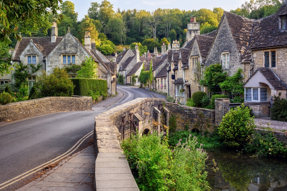 Traditional stone houses in Castle Combe village, one of the most picturesque villages in Cotswolds, England, United Kingdom