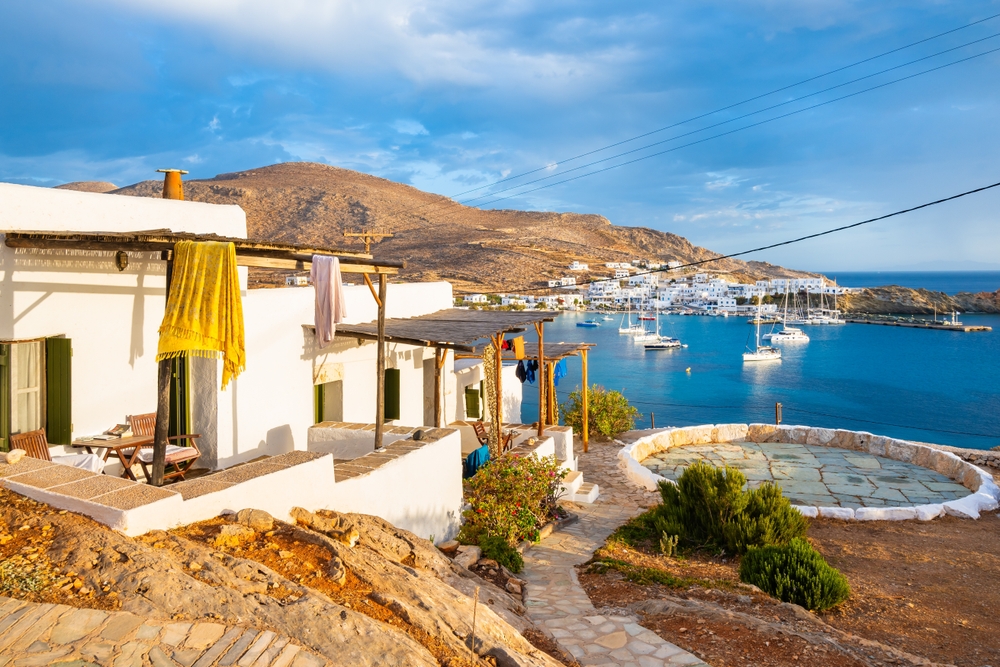 Traditional style Greek apartments at sunrise in Karavostasis port, Folegandros island, Cyclades, Greece