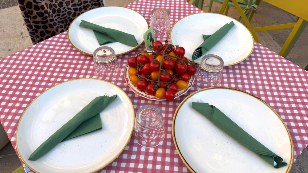 Rustic Italian Restaurant Table Setting with Fresh Cherry Tomatoes and Checkered Tablecloth