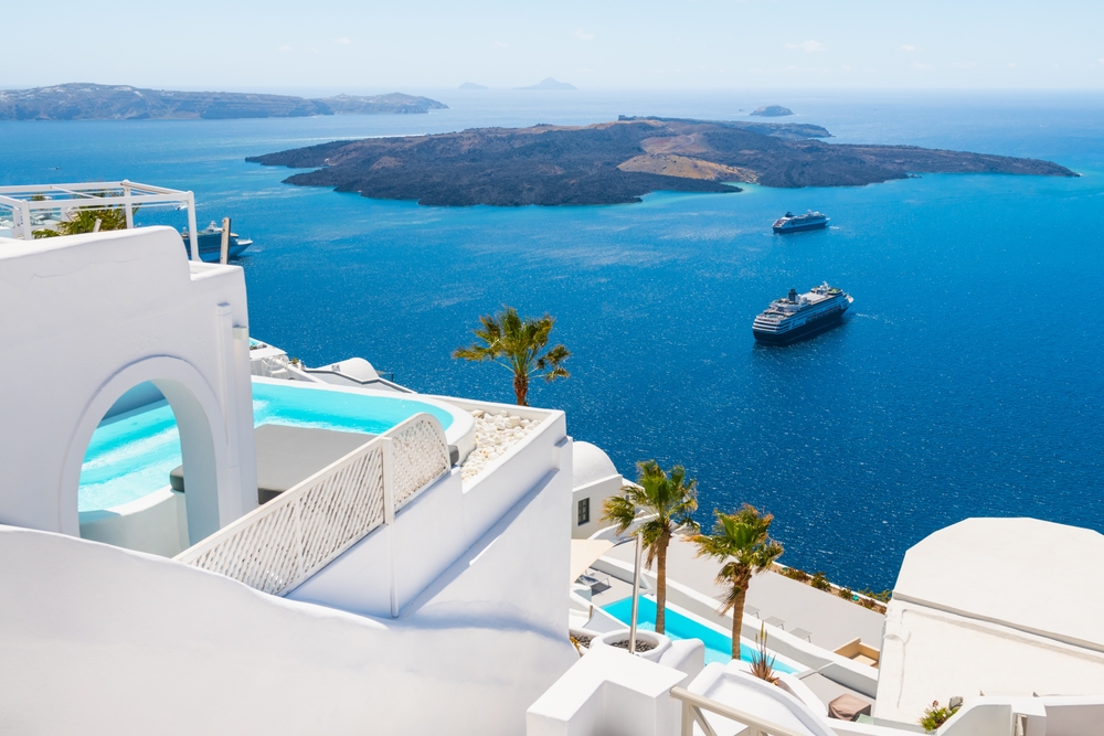 White architecture in Santorini island, Greece. Beautiful sea view in sunny day. Travel and vacation concept