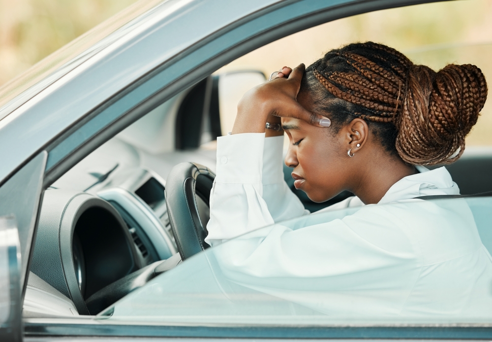 Black woman, car problem or headache stress on road for auto repair service insurance to travel.