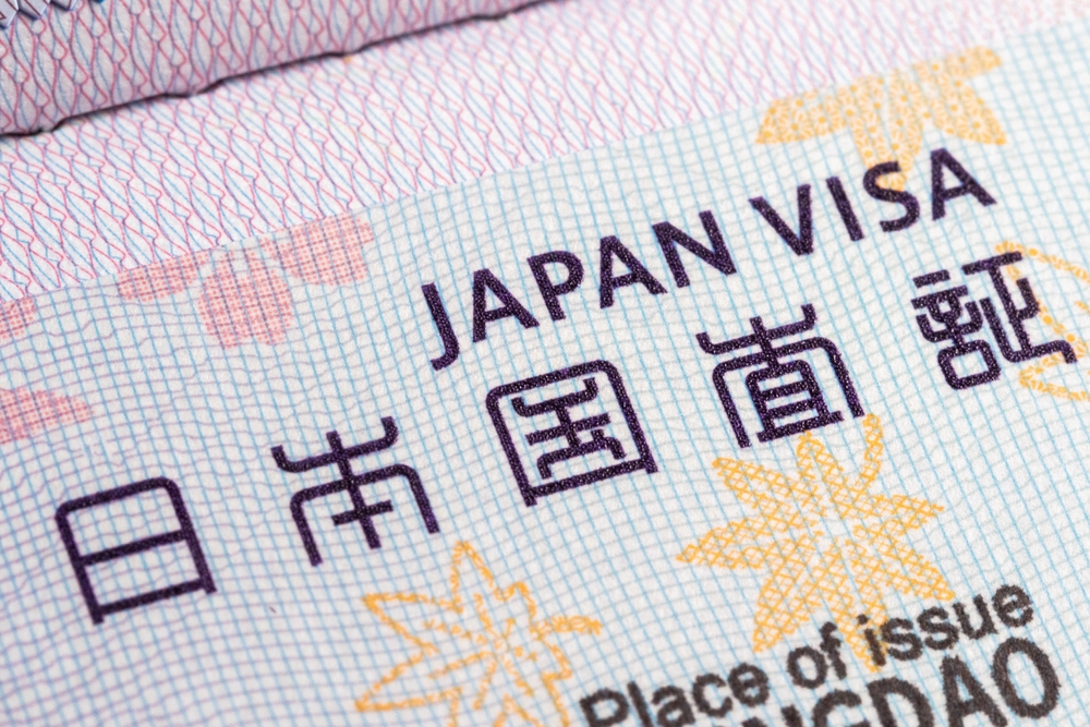 A close-up view of a Japan visa page from a passport, showing the text "JAPAN VISA" and "日本国査証" in both English and Japanese.