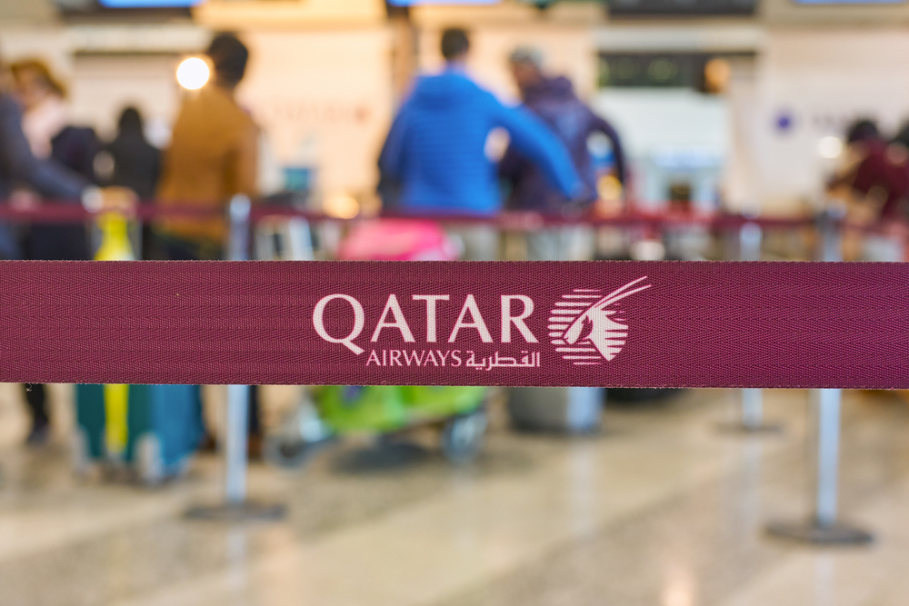 close up shot of Qatar Airways sign at check-in area