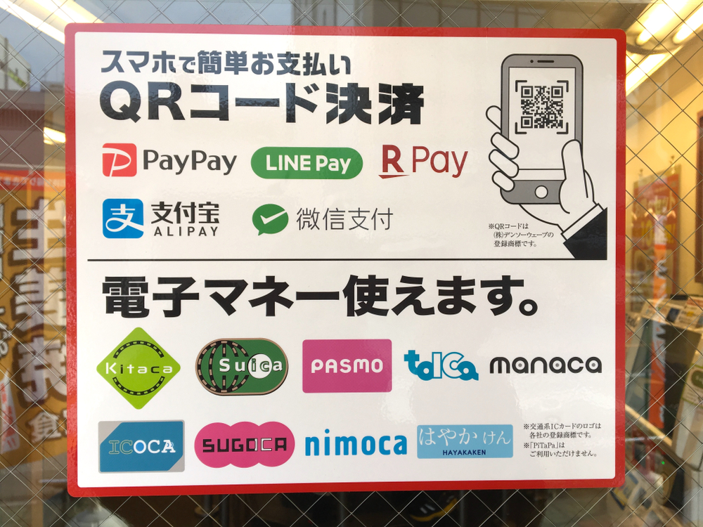 SIGN of various kinds of ELECTRONIC PAYMENT AVAILABLE at the shop in Tokyo.
